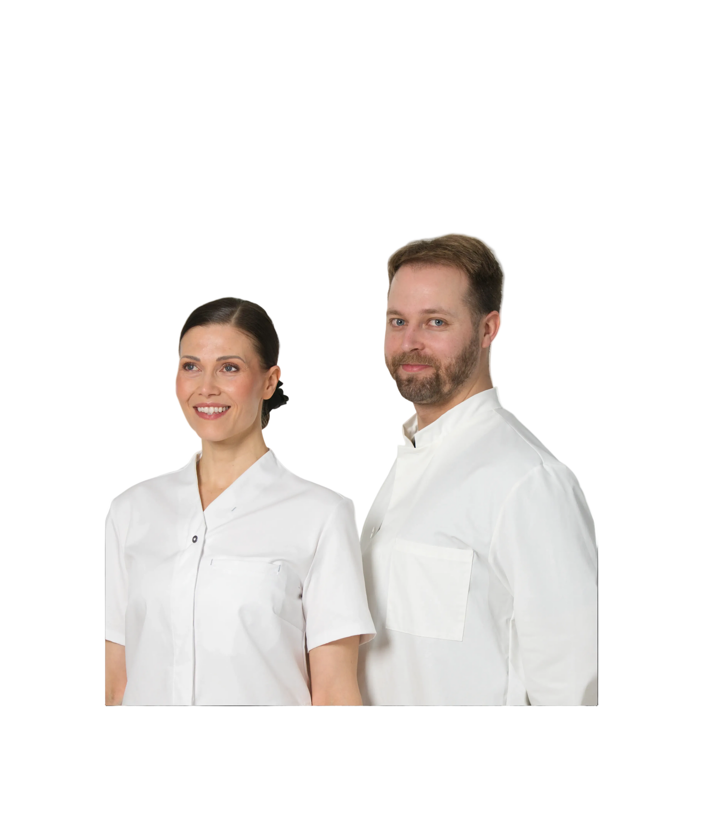 Kuvassa mies ja nainen seisovat vierekkäin. Molemmilla Image Wearin terveydenhuollon valkoiset työvaatteet.