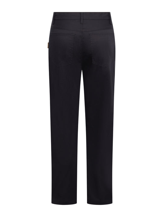 Tummansiniset farkkumalliset työhousut takaapäin kuvattuna. 