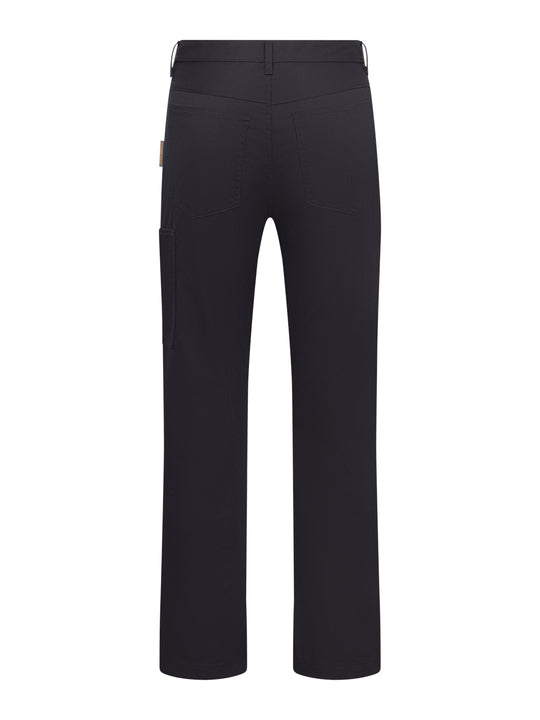 Tummansiniset miesten reisitaskuhousut takaapäin kuvattuna. 