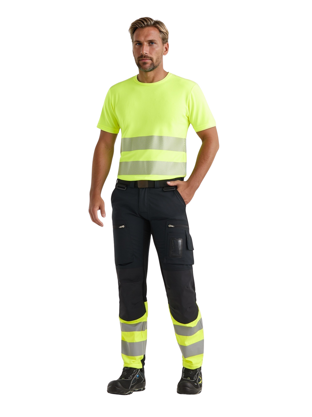 Miesmallilla kuvassa päällä Image Wearin keltainen varoitus t-paita ja musta-keltaiset reisitaskuhousut. Jalassa mallilla on Sievin Roller turvajalkineet. 