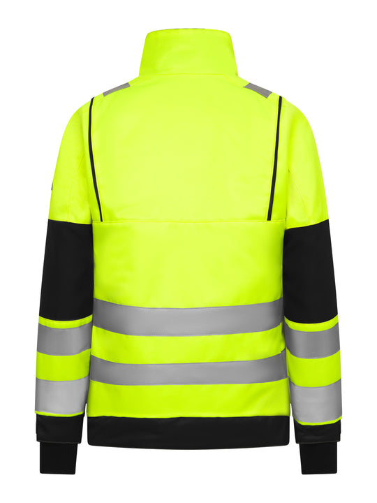 Naisten näkyvä keltainen talvivaroitustakki takaapäin kuvattuna.