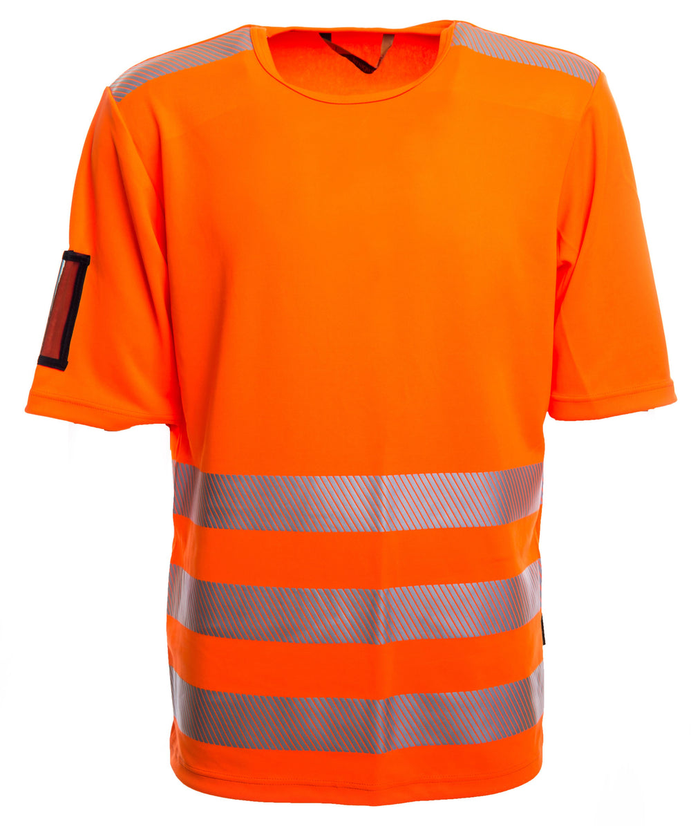 Fluoresoiva oranssi lyhythihainen varoitus t-paita. Olkapäillä heijastinnauhat ja kolme heijastinnauharaitaa edessä. Pyöreä pääntie. Vasemmassa hihassa käyntikorttikotelo.